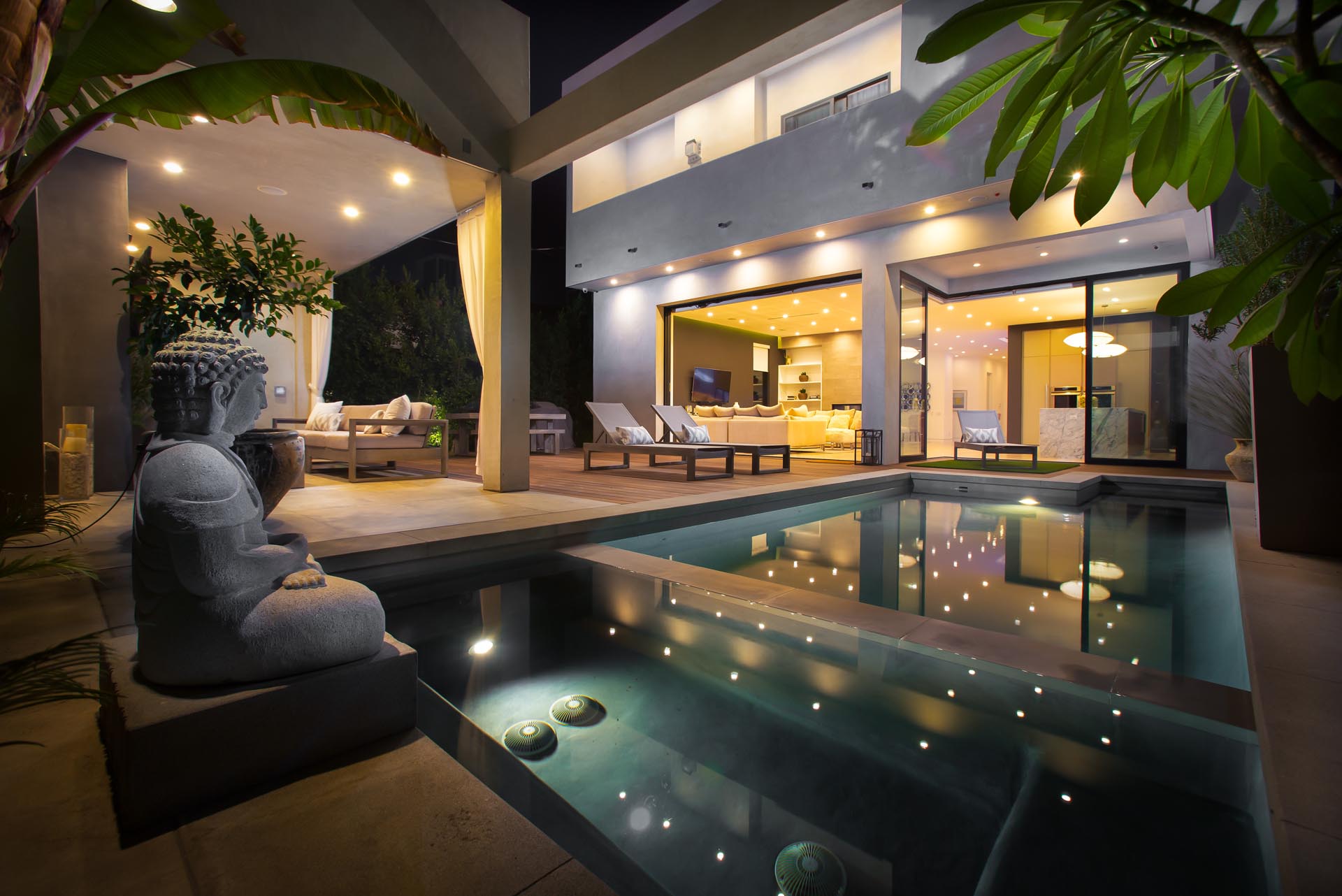 Private courtyard pool at night